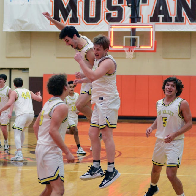 Alex Williams, left, and Luke Lyall celebrate after Tri-Valley's 47-38 win in a Division II district semifinal on Wednesday at Claymont High School in Uhrichsville.