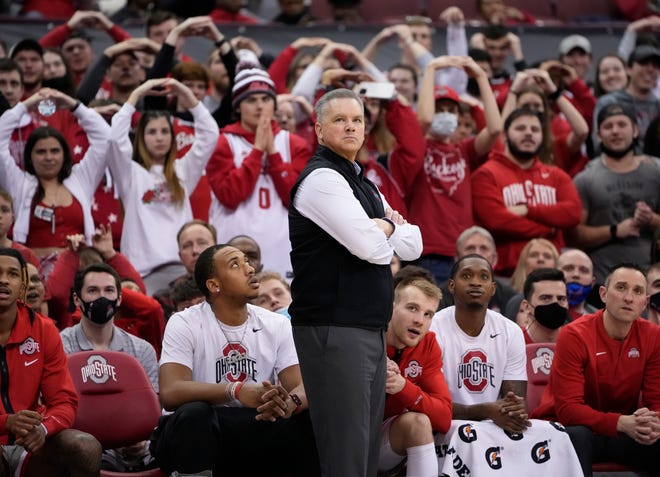 Ohio State Buckeyes head coach Chris Holtmann watches during the second half of the NCAA men's basketball game against the Michigan State Spartans at Value City Arena in Columbus on March 3, 2022. Ohio State won 80-69.