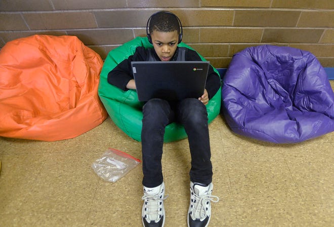 First-grader Dontrell Gilbert attends an after-school program at the Booker T. Washington Center on March 2. The Erie School District is using pandemic-relief funding to pay for after-school programs at the city's community centers, and the district is considering raising taxes to retain the programs when the federal pandemic money runs out in September 2024.