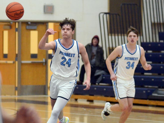 Brady Ewing (24), Jace Copeland (34) and the Petoskey boys' basketball team will regroup after taking a loss from Mount Pleasant to finish up the regular season Thursday.