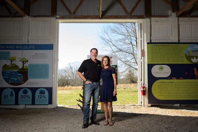 Henry Didier and his wife Allison pose for a portrait at The Preserve at Lakewood Thursday March 2, 2022. The privately-owned park will focus on sustainability and the environment. 