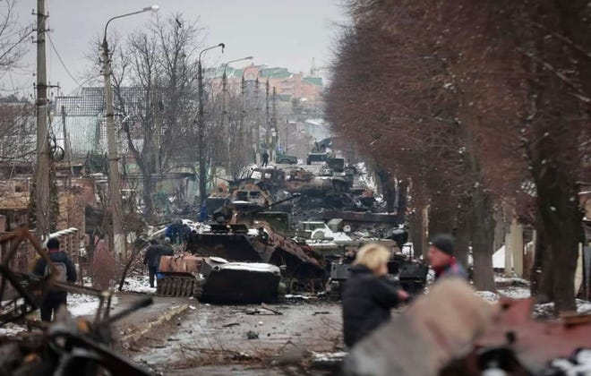 Destroyed military vehicles on a street in the town of Bucha in the Kyiv region, Ukraine, March 1.