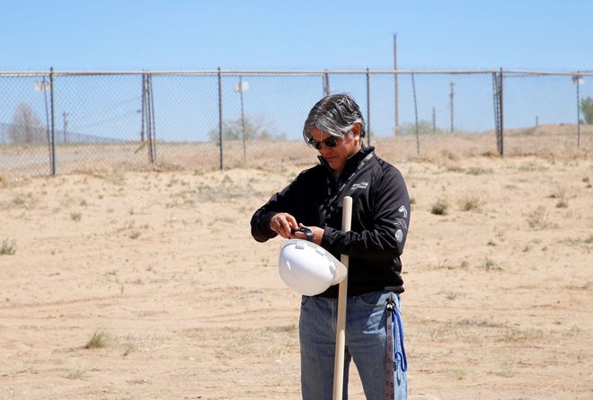 Daniel Benavidez adjusts his hard hat before the groundbreaking ceremony on April 30, 2021 for new teacher housing in Shiprock. The Central Consolidated School District Board of Education did not renew Benavidez's contract as superintendent on March 3.