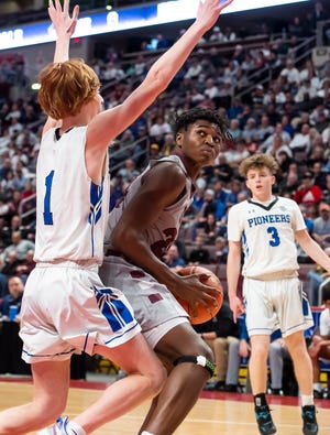 Shippensburg's Jeremy Thomas prepares to post up against Lampeter-Strasburg's Luka Vranich (1) during the first quarter of the District 3 Class 5A boys' basketball championship at the Giant Center on Thursday, March 3, 2022, in Derry Township. The Greyhounds fell, 66-57. 