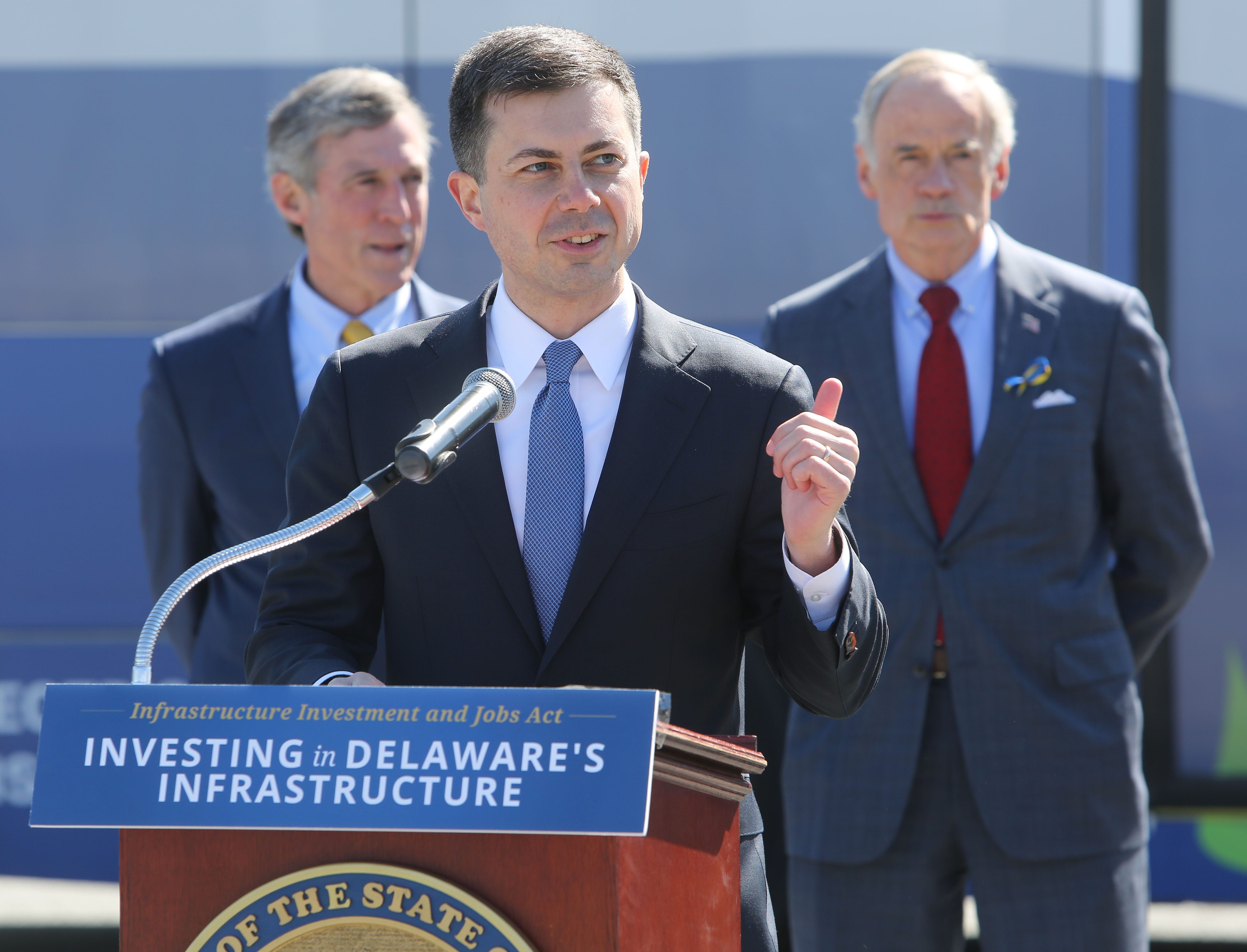 U.S. Secretary of Transportation Pete Buttigieg speaks about the president's infrastructure plan on March 4, 2022, where Delaware is expected to receive about $186 million to improve public transportation. Behind him, Gov. John Carney and Sen. Tom Carper listen on.
(Photo: Damian Giletto/Delaware News Journal)