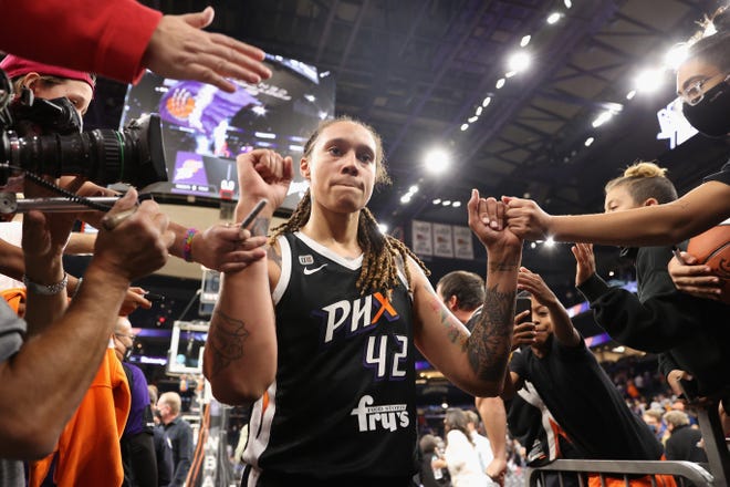 Brittney Griner #42 of the Phoenix Mercury celebrates with fans following Game Two of the 2021 WNBA Finals at Footprint Center on Oct. 13, 2021. in Phoenix, Arizona. The Mercury defeated the Sky 91-86 in overtime.