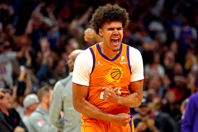 Mar 4, 2022; Phoenix, Arizona, USA; Phoenix Suns forward Cameron Johnson (23) celebrates after hitting the game winning shot at the buzzer against the New York Knicks at Footprint Center.