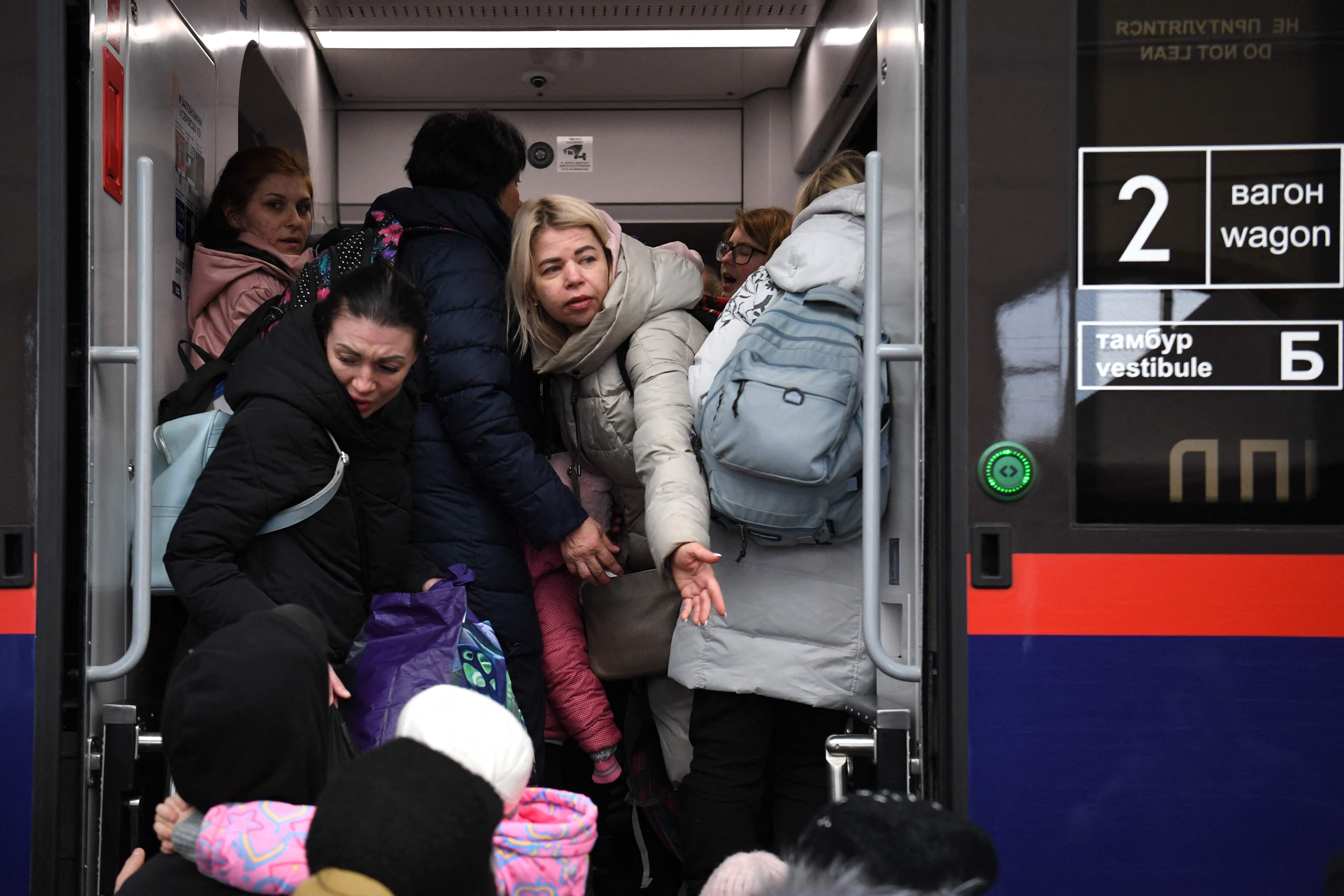 Evacuees board a train to Poland, at the Lviv train station, western Ukraine, on March 5, 2022.