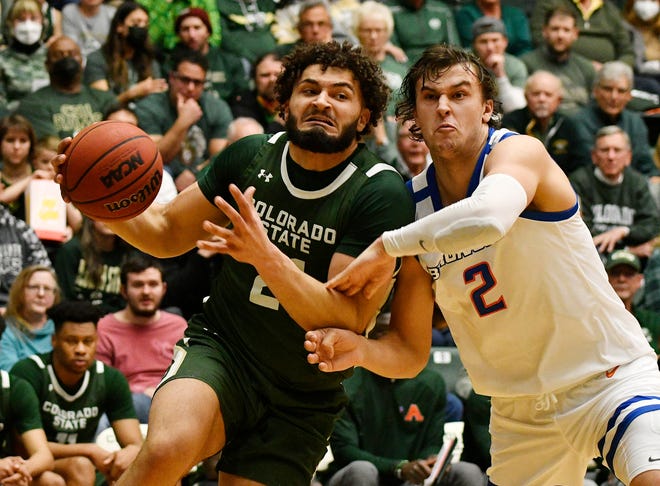 Colorado State's David Roddy, left, drives to the basket against Boise State forward Tyson Degenhart during the Rams' win on Saturday.
