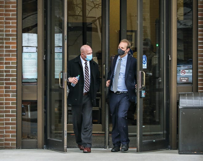 Matthew A. Marshall, left, and his attorney, Justin Gelfand, exit the Russell Smith Federal Courthouse in Missoula, Mont., on Nov. 10, 2021, after a change-of-plea hearing during which Marshall admitted to criminal charges of wire fraud, money laundering and tax evasion. Marshall was sentenced on Thursday, March 3, 2022, to six years in federal prison and ordered to pay $3.25 million in restitution for portraying himself as a high-ranking intelligence official and convincing a wealthy philanthropist to give him money for nonexistent off-the-books CIA operations.