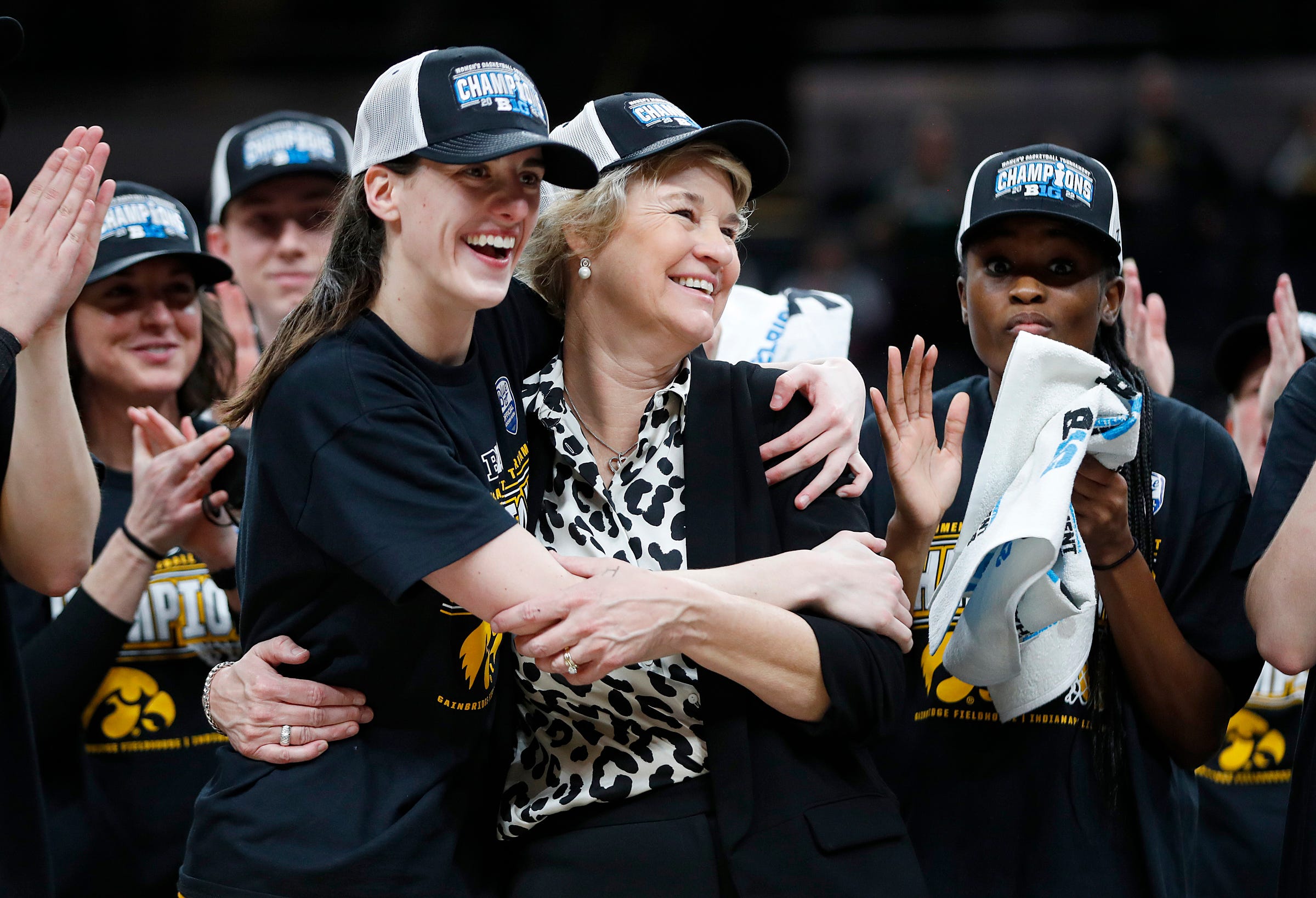 Iowa Hawkeye Caitlin Clark (22) and head coach Lisa Bluder celebrate after the team defeated the Indiana Hoosiers for the BIG Ten women's championship title Sunday, March 6, 2022, at Gainbridge Fieldhouse in Indianapolis. The final score was 74-67.