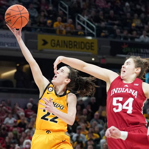 Iowa guard Caitlin Clark (22) makes a shot and is 
