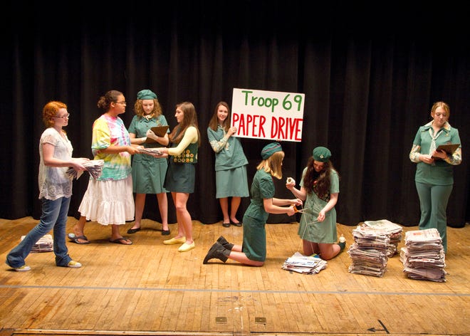 A photo taken from the 100th anniversary celebration in 2012, Oak Ridge Girl Scouts portray Troop 69’s newspaper recycling program from the 1970s.