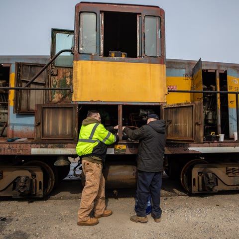 Taras Terlecky, left, and Don Gregory, right, work