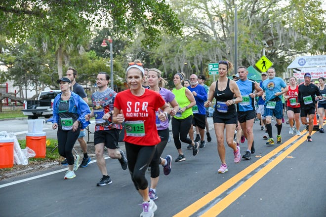 Tim Walters, FLORIDA TODAY Sports and Health Editor, second from left, running in the eye of the Dragon 10K on Feb. 20, 2022.