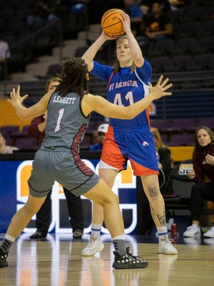 UT Arlington Guard Katie Ferrel (No. 41) l looks for an open teammate as Troy University's Amber Leggett (No. 1) brings on the defense during the Women's Sunbelt Conference basketball championship game at the Pensacola Bay Center on Monday, March 7, 2022. 