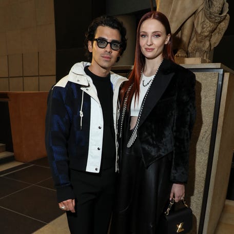 Joe Jonas, left, and Sophie Turner attend the Louis Vuitton fashion show during Paris Fashion Week on March 7.