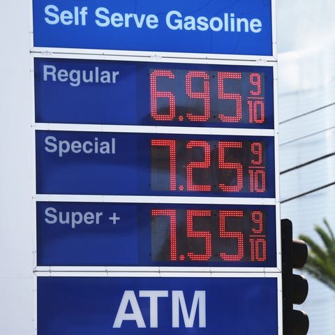 High gas prices are displayed at a Mobil station a
