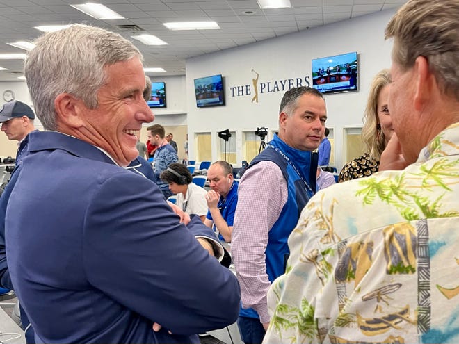 PGA Tour commissioner Jay Monahan chats with members of the media after his news conference on Tuesday at The Players Championship media center.