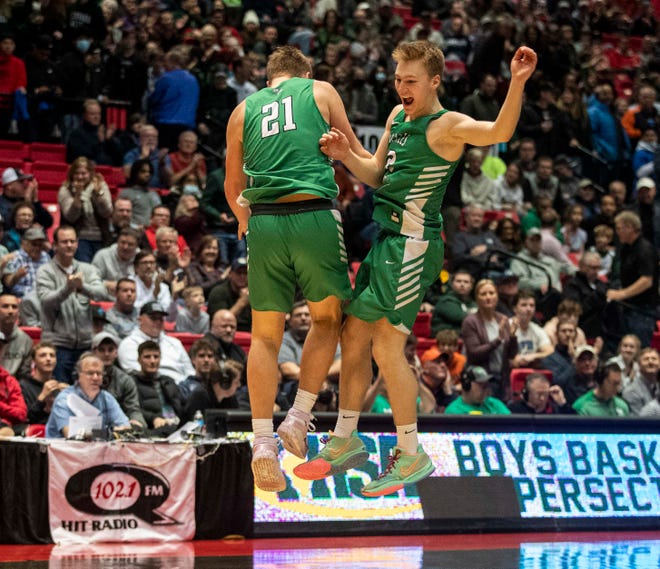 Scales Mound’s Ben Werner and Collin Fosler celebrate a supersectional win over the Chicago Marshall Commandos at Northern Illinois University Convocation Center on Monday, March 7, 2022, in Dekalb.