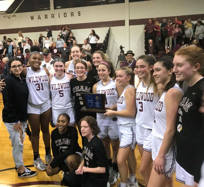 The Wildwood High School girls' basketball team celebrated its first sectional title in five years with a 50-38 win over Woodbury.