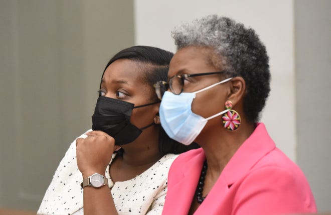 Toni Johnson of Jackson, Hinds County District 2 election commissioner, and her attorney Lisa Ross listen to arraignment proceedings before Hinds County Special Circuit Judge Jess Dickinson at the Hinds County Courthouse in Jackson Tuesday, March 8, 2022. Johnson reached a plea agreement with the district attorney's office on embezzlement and fraud.