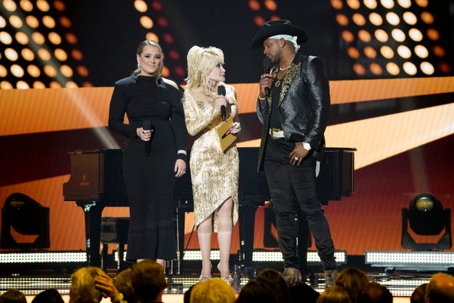 Gabby Barrett, Dolly Parton and Jimmie Allen appear on stage during the 57th Academy of Country Music Awards at Allegiant Stadium in Las Vegas, Nev., Monday, March 7, 2022.