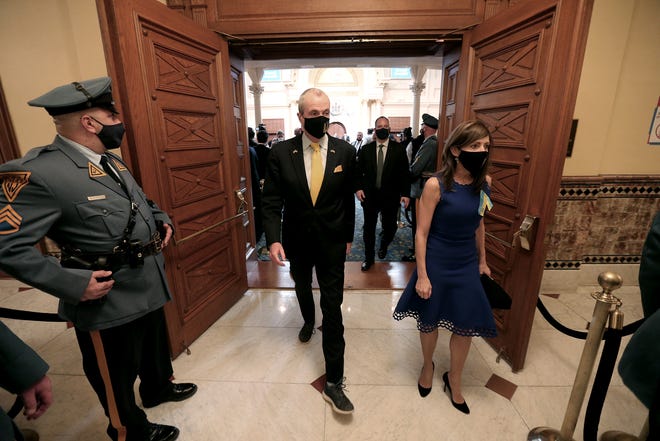 On Tuesday, March 8, 2022, New Jersey Gov. Phil Murphy and wife Tammy leave the floor at the State Capitol in Trenton after delivering a budget speech.