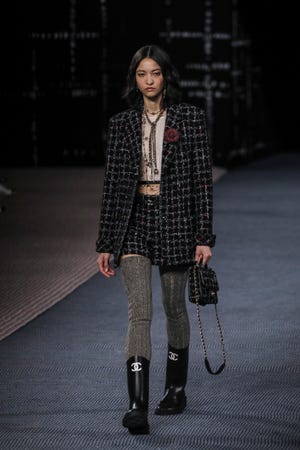A model walks the runway at the Chanel fashion show during Paris Fashion Week on March 8, 2022.