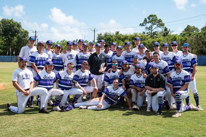 The Stonehill College baseball team poses with coach Pat Boen following his 600th career win.