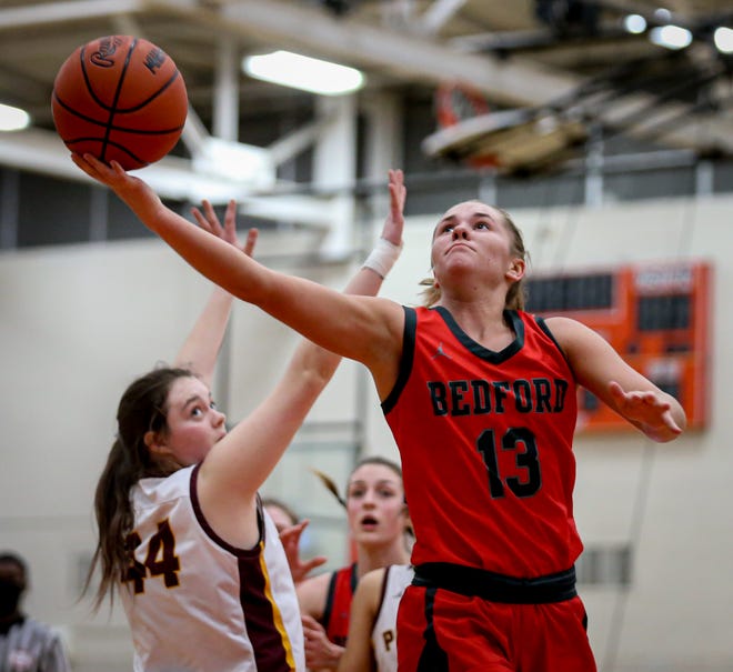 Bedford's Payton Pudlowski goes up for a shot in the fourth quarter against Riverview's Haley Guest during the Division 1 Regional semifinal Tuesday, March 8, 2022 at Dearborn.