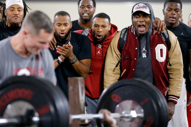 From left, Nik Bonitto, Kennedy Brooks, Justin Broiles and Perrion Winfrey cheer for a teammate during OU's Pro Day inside the Everest Training Center in Norman on Wednesday.