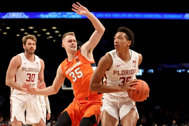 Mar 9, 2022; Brooklyn, NY, USA; Florida State Seminoles guard Matthew Cleveland (35) controls the ball against Syracuse Orange guard Buddy Boeheim (35) during the first half at Barclays Center. Mandatory Credit: Brad Penner-USA TODAY Sports