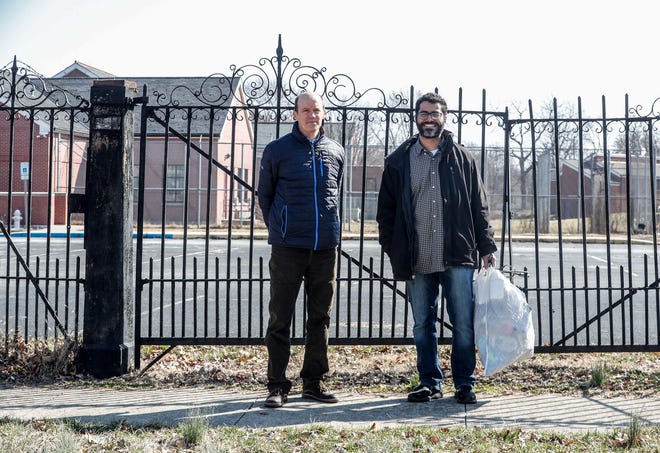 IREF Advocacy Alliance founders, Will Pritchard, left, and Joey Newsom, right, are photographed in front of the historic iron gates of the former Indiana Women's Prison on Randolph St., Wednesday, March 9, 2022, in Indianapolis. The men who live near the prison campus and fellow neighbors want a say in future development at the historic site. The 15 acre campus is unique in that it's surrounded by homes, and was the first women's prison in the country. It operated for 136 years until it moved to the west side of Indianapolis.
