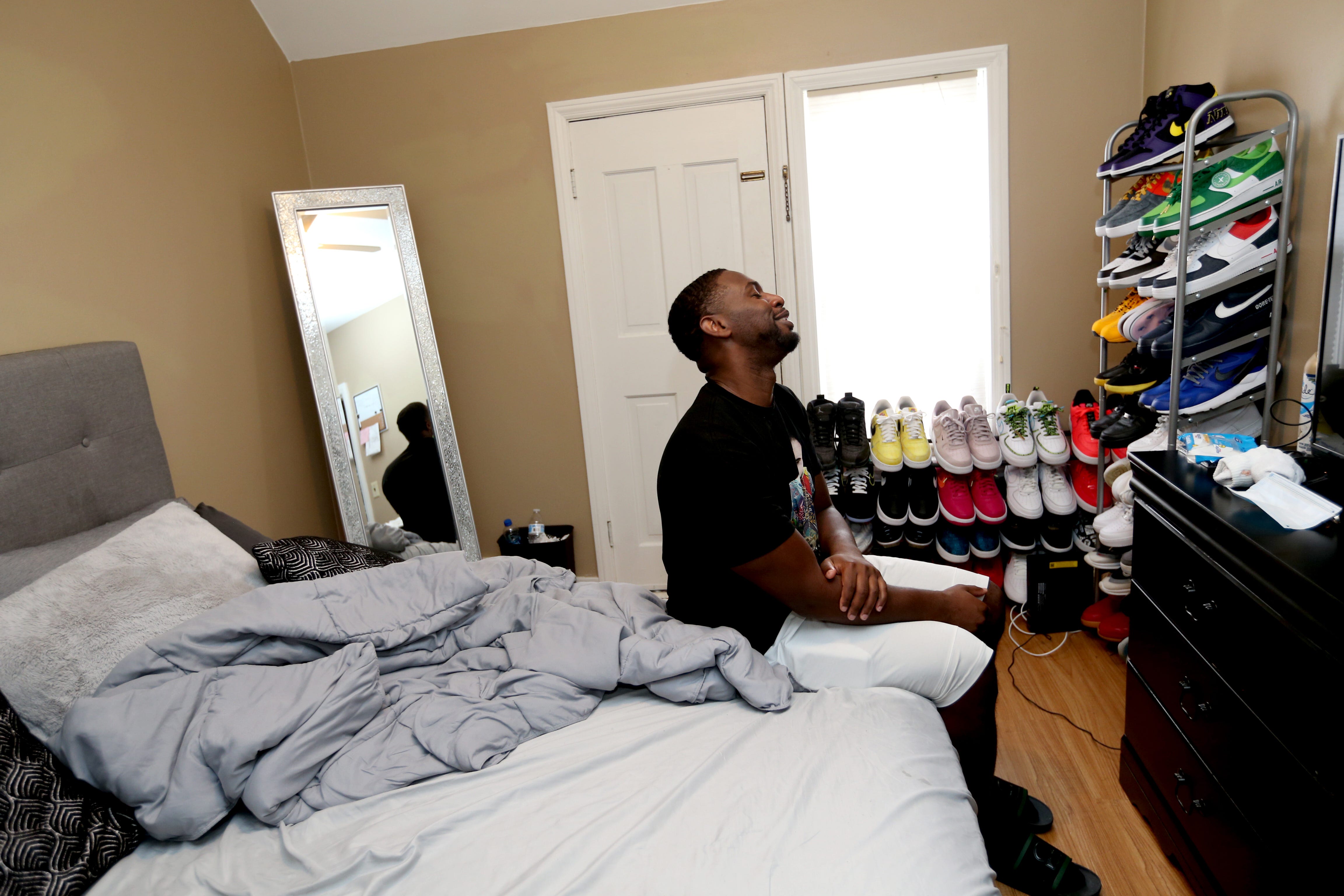 Marlin Dixon relaxes at his apartment in Menomonee Falls on the one-year anniversary of his release from the John C. Burke Correctional Center.