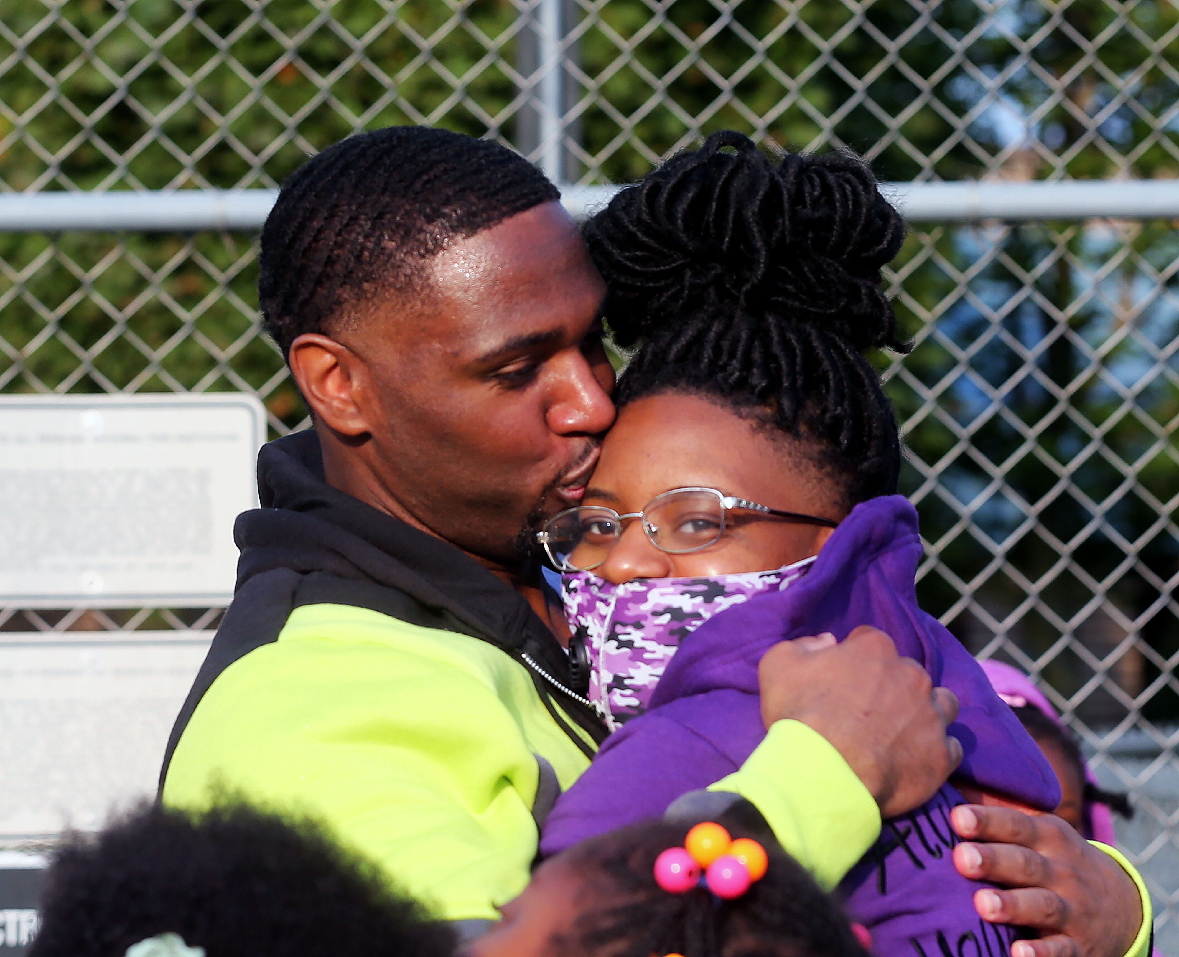 Marlin Dixon, left, embraces his daughter, Kamariya, at his release from the John C. Burke Correctional Center in Waupun. She was a baby when her father was sentenced.