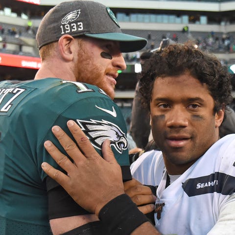 QBs Carson Wentz (11) and Russell Wilson will both
