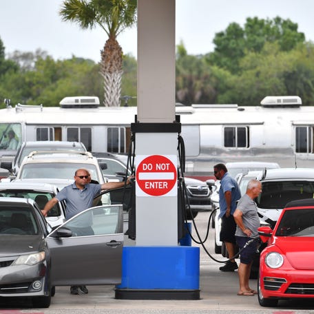 Drivers line up to fill their gas tanks at Costco Wholesale in Sarasota. Increased travel as the  pandemic seems to be letting up and the crisis in Ukraine have caused gas prices to spike. 