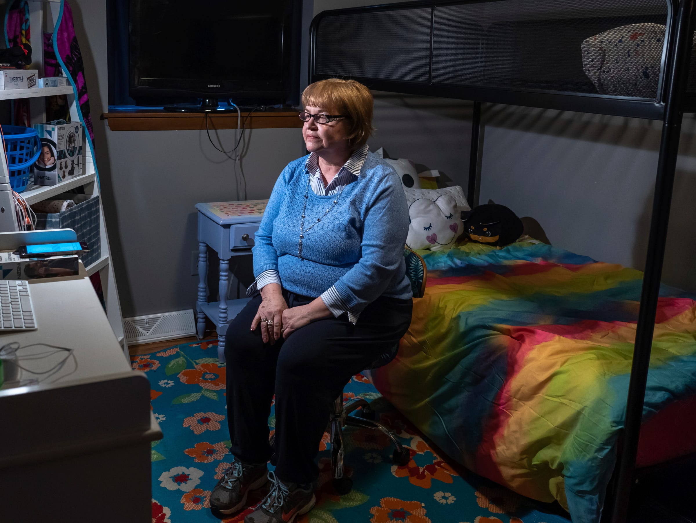 Kathy Reeder of Saginaw sits March 2 in a room she redecorated for her granddaughter in hopes of her return to Reeder's home with her two siblings.