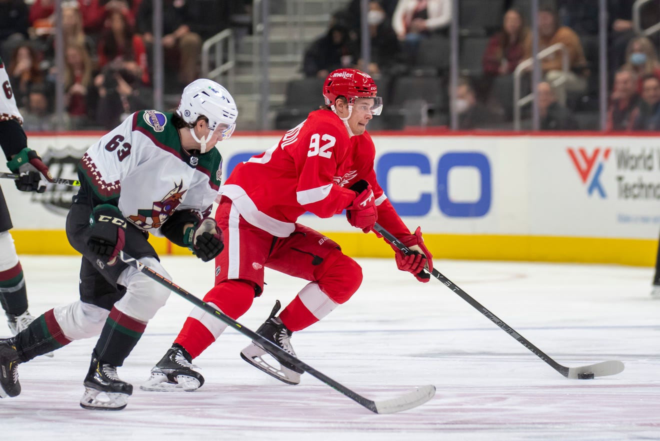 Red Wings center Vladislav Namestnikov races the puck away from Coyotes left wing Matias Maccelli during the first period Tuesday in Detroit.