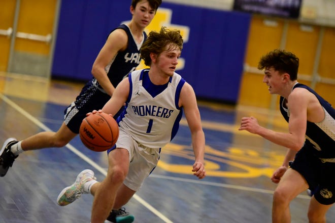 Croswell-Lexington's Trey Kolakovich pushes the ball in transition during a game earlier this season. The Pioneers are 22-0 and will face Goodrich in a Division 2 regional semifinal on Monday.