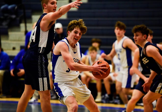 Croswell-Lexington's Zack Kroetsch drives to the basket during a game last season. He led all scorers with 19 points in the Pioneers' 54-51 overtime victory against Armada on Thursday.