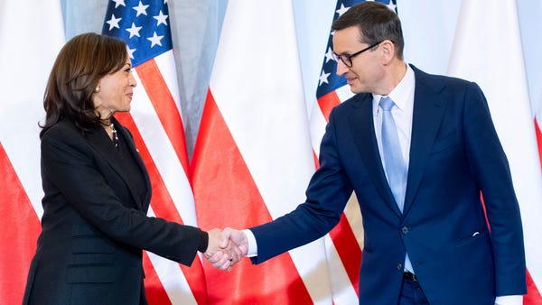 Poland's Prime Minister Mateusz Morawiecki, right,