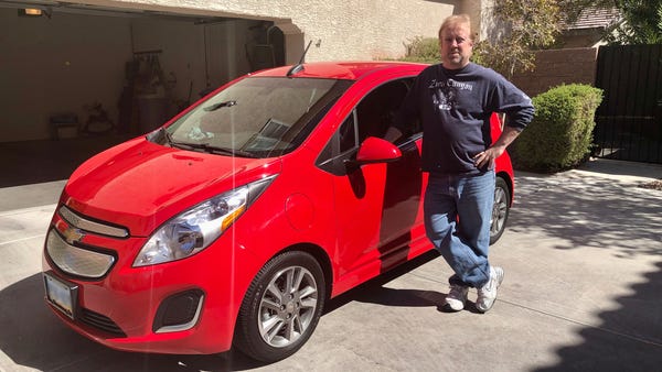 Paul Bordenkircher, who owns a Chevy Spark, does s