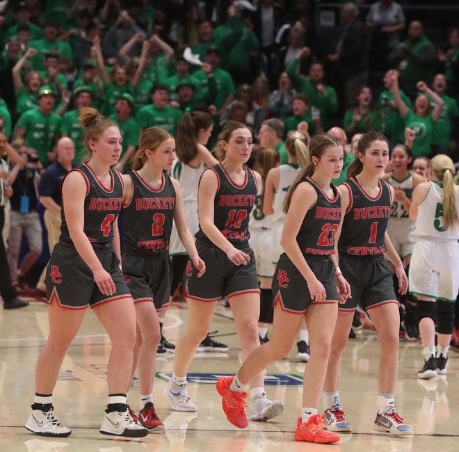 The Buckeye Central team leaves the court after their 53-39 loss to Waterford in the Division IV State Semifinal game at University of Dayton Arena Friday in Dayton.