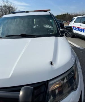 A bullet hole in the front of a Columbus police cruiser that was allegedly fired by accused gunman Jonathon Myers, 21, of Columbus, on March 11 on Interstate 71 northbound in Delaware County.  The multiple bullet holes in the window are believed to have been fired by the officer inside returning fire, though one or two may also be from the gunman.