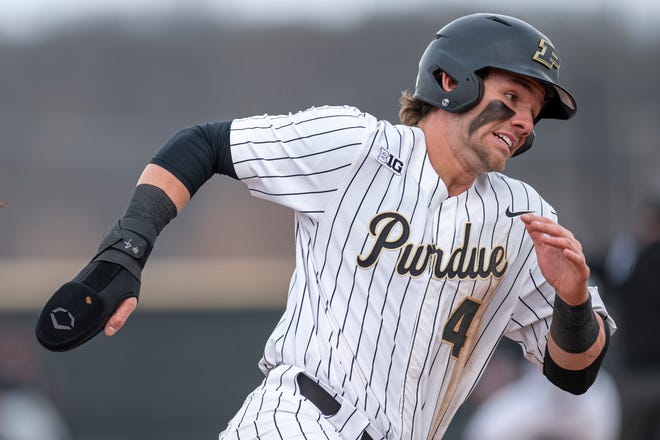 Purdue outfielder/infielder Cam Thompson (4) runs out a  infield single in the Bellarmine Knights at Purdue Boilermakers baseball game, Thursday Mar. 10, 2022 in West Lafayette.