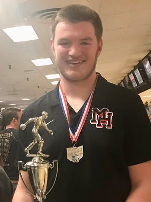 Marion Harding senior Caden Millisor poses with the Division I state runner-up trophy and medal at this year's boys bowling state tournament at Wayne Webb's Columbus Bowl. Millisor was named Fahey Bank Athlete of the Month for Marion County males for March.