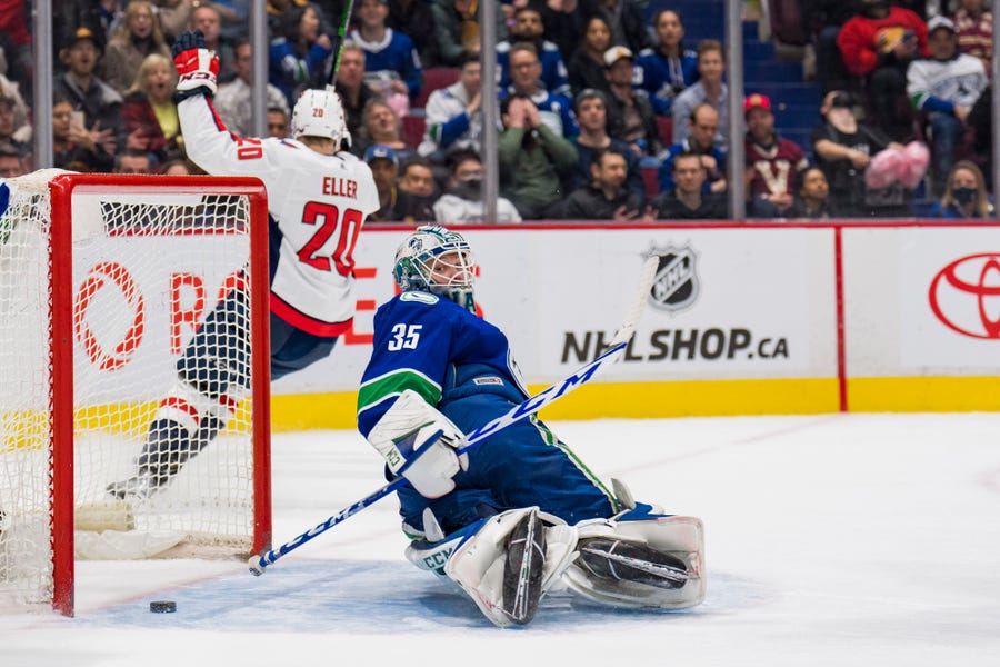 March 11: Washington Capitals forward Lars Eller scores the game-winning goal in overtime against the Vancouver Canucks at Rogers Arena.