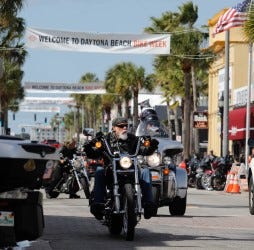 Revelers enjoy the last few hours of Daytona Bike Week 2022 on Bikers roll down Main Street in Daytona Beach on the last day of Bike Week 2022, Sunday, March 13.